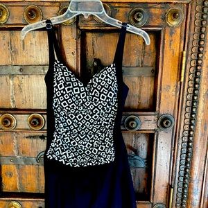 One piece bathing suit with attached skirt